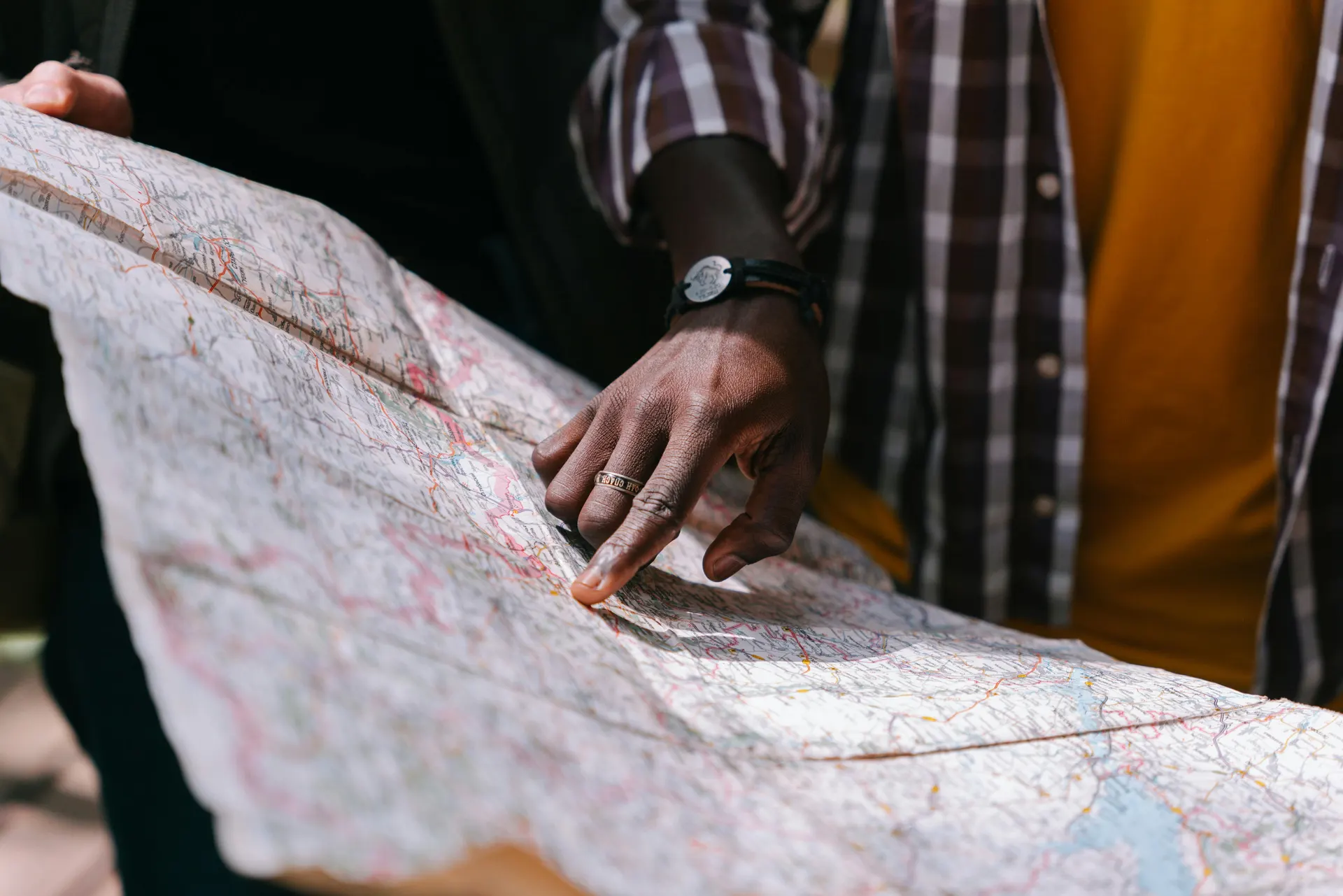 Travellers reviewing a Malaysia rail and air route plan