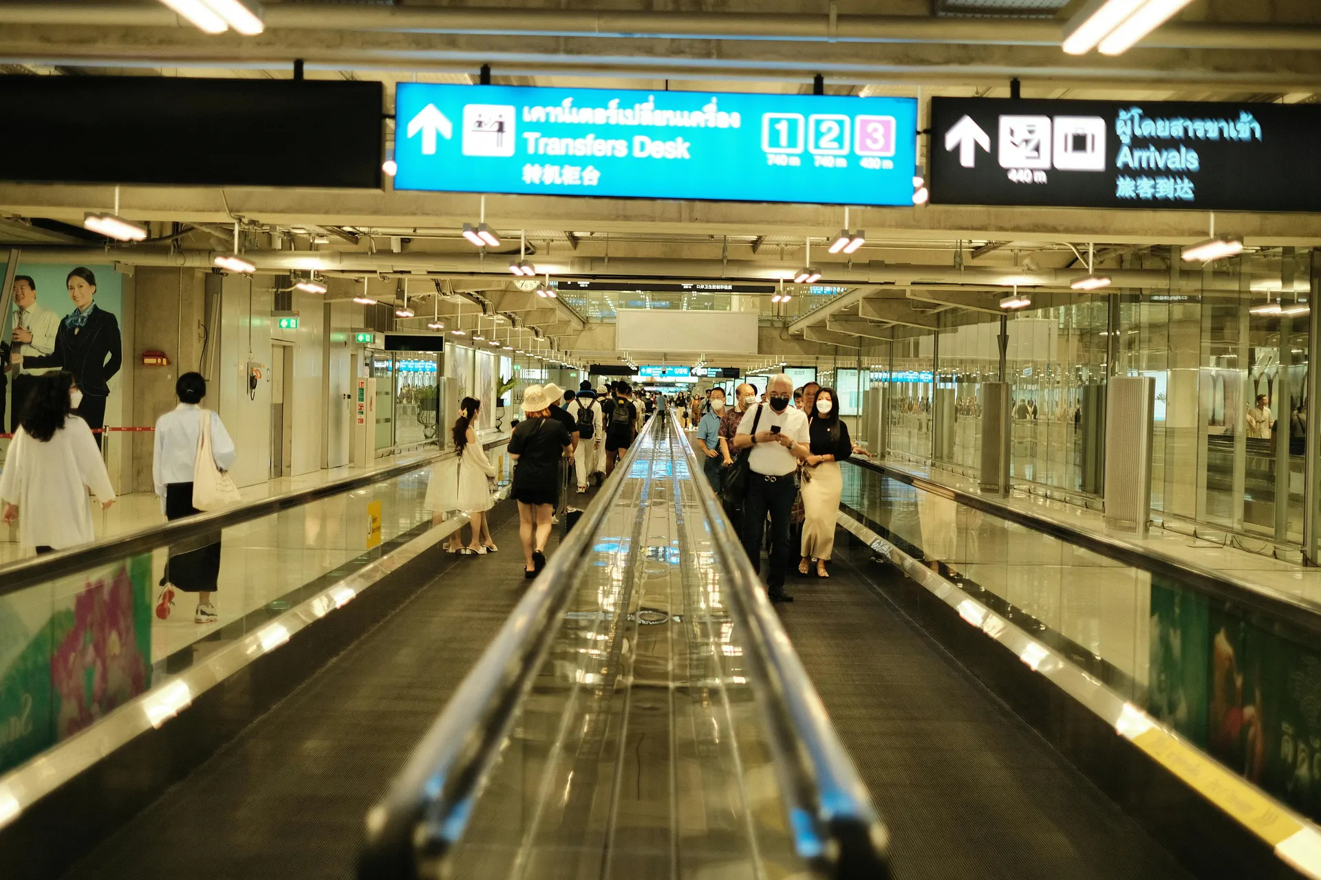 Travellers moving through a Malaysia airport rail connection