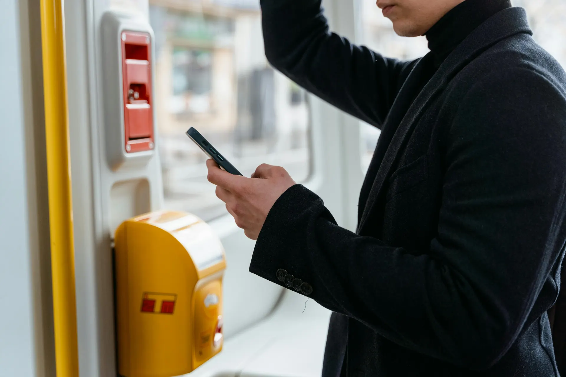 Traveller checking a mobile rail ticket in Malaysia